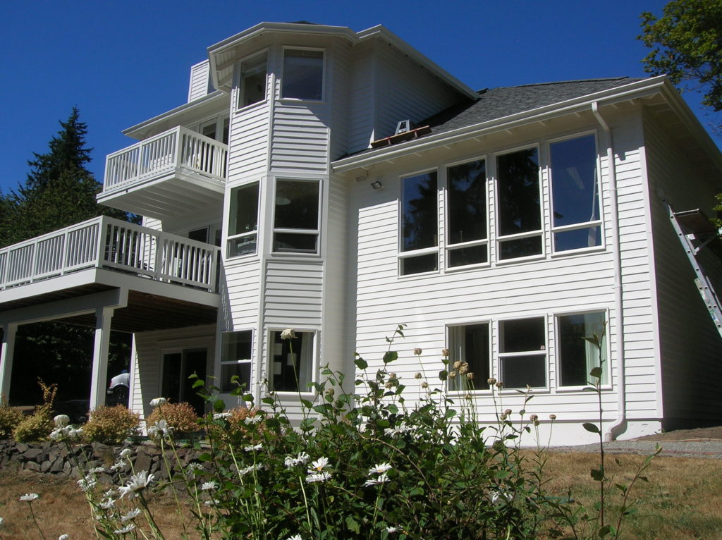 A stately Bainbridge Island house, with three floors and a front yard